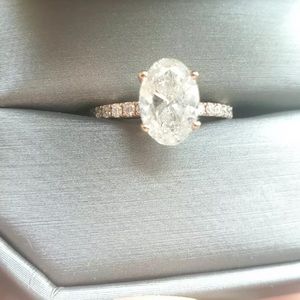 Gorgeous ring main stone is 1.99 Ct total oval diamond ring